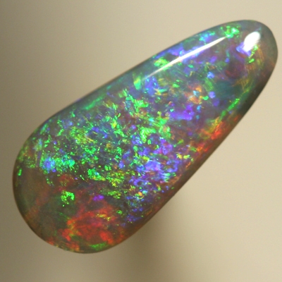 SOLID SEMI BLACK OPAL Pretty glittery show of greens and golds over blue and red. SEE VIDEO